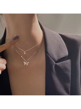 Double butterfly is a centerpiece of this trendy necklace pave-set with AAA CZ's